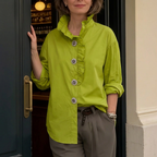 Stylish And Casual Long-sleeved Cotton Shirt With Rhinestone Buttons And A Ruffled Collar.