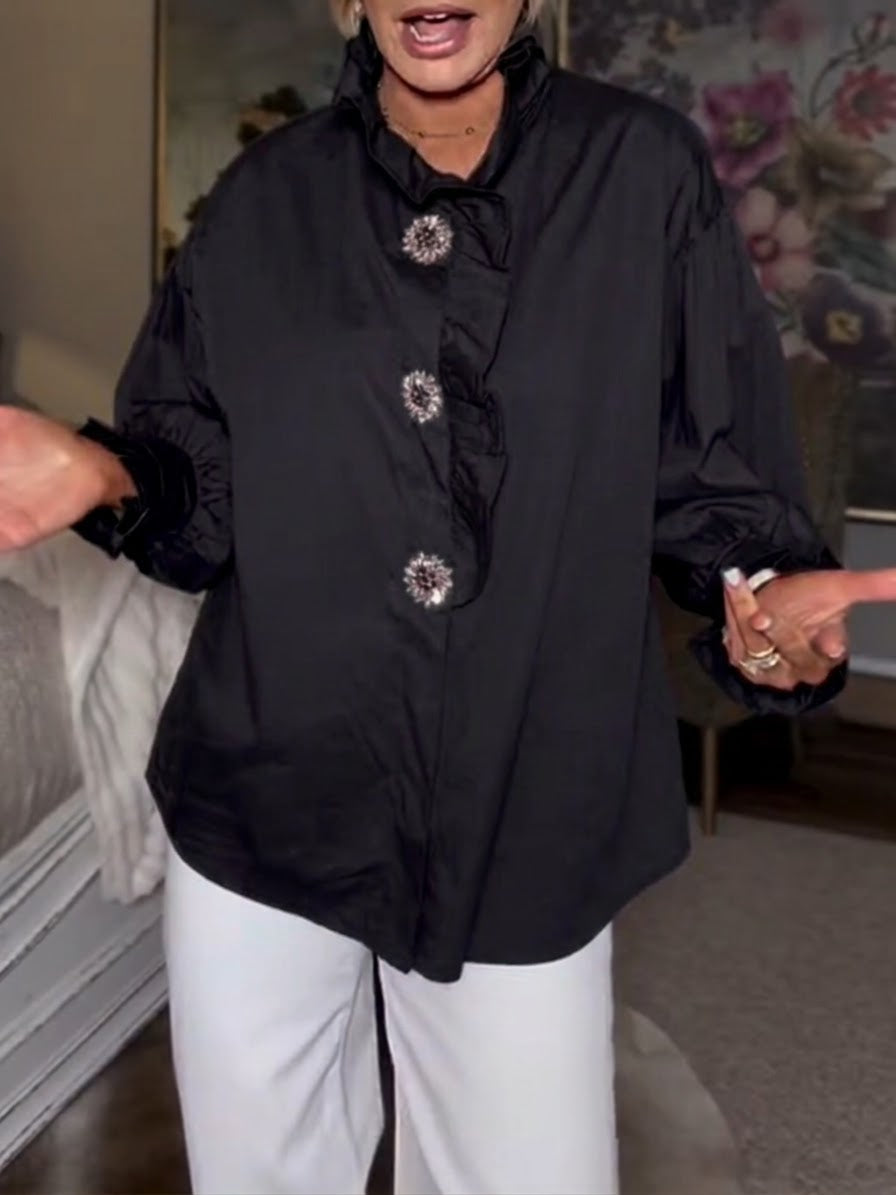 Stylish And Casual Long-sleeved Cotton Shirt With Rhinestone Buttons And A Ruffled Collar.